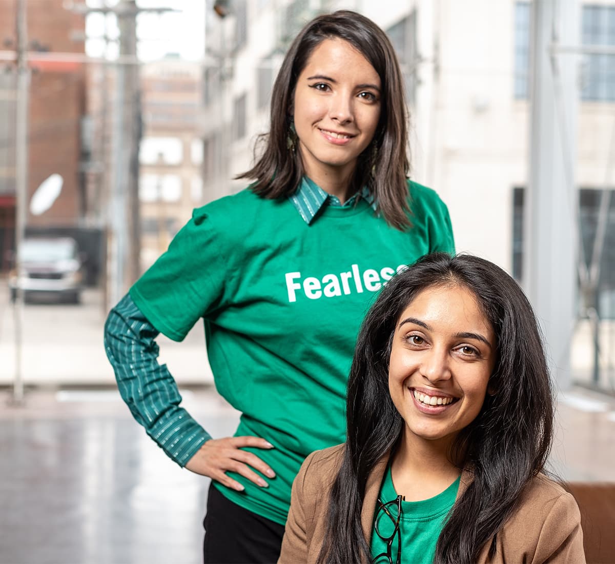To women wearing green shirts that say fearless
